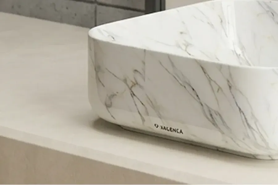 Marble vessel basin with matte black faucet on a vanity