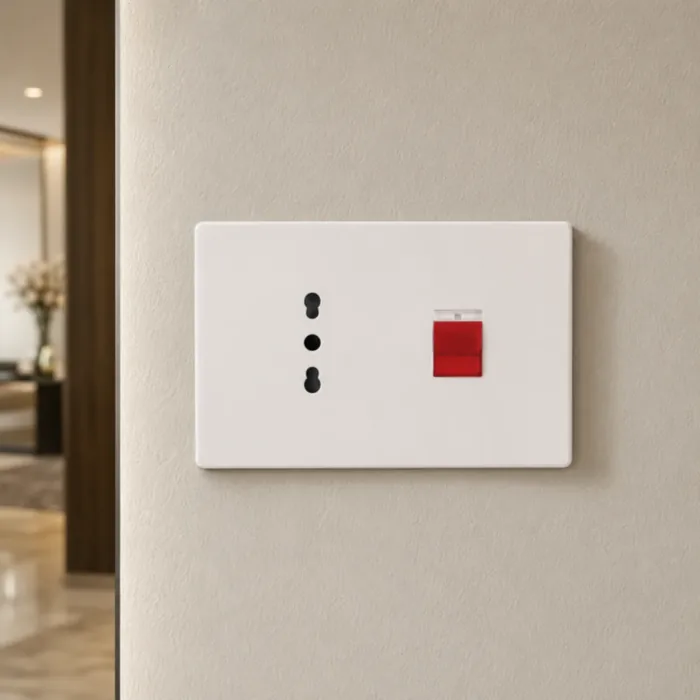White plate combining an Italian three pin socket and a switch with a red pilot light