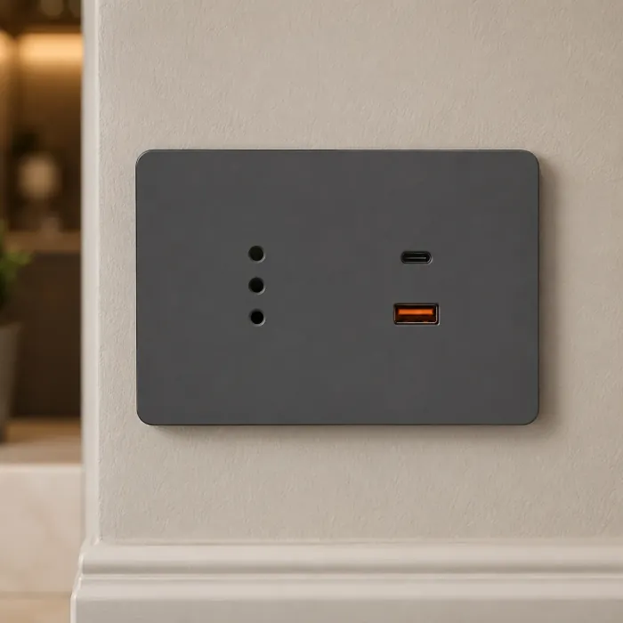 Matte graphite outlet with an Italian three-pin socket, a USB-C and a USB-A port