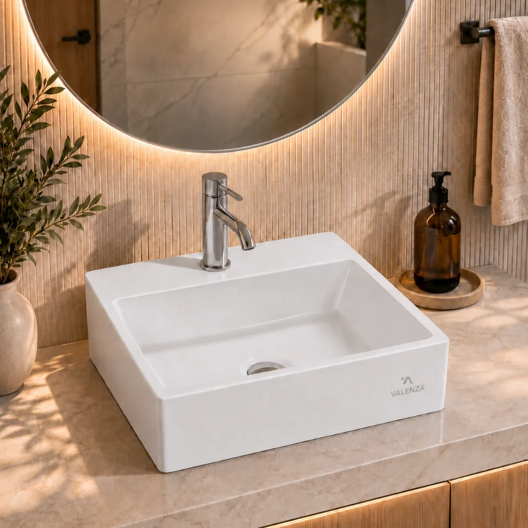 Rectangular white ceramic counter-top basin with a chrome mixer