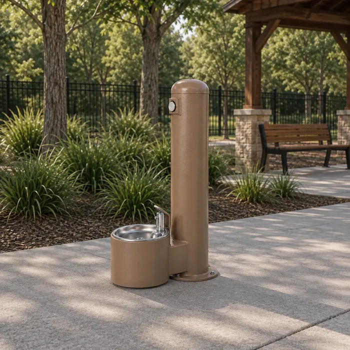 Sand-coloured drinking fountain with a dog bowl at ground level