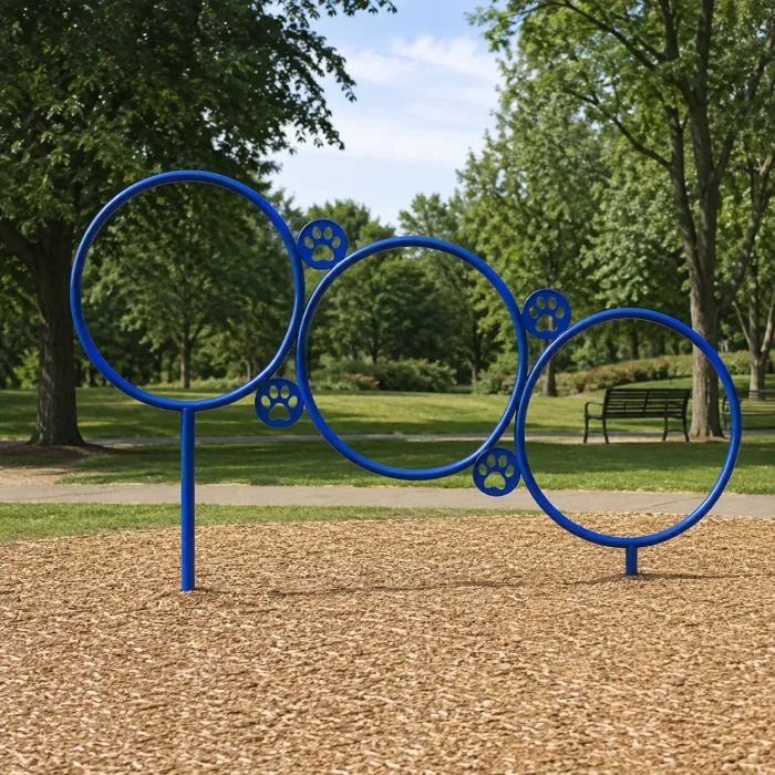 Blue steel hoop jump with paw-print cutouts on a wood mulch bed