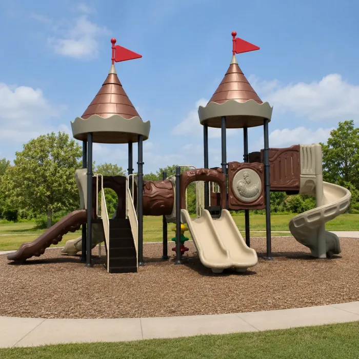 Castle-themed playground with two turrets and three slides