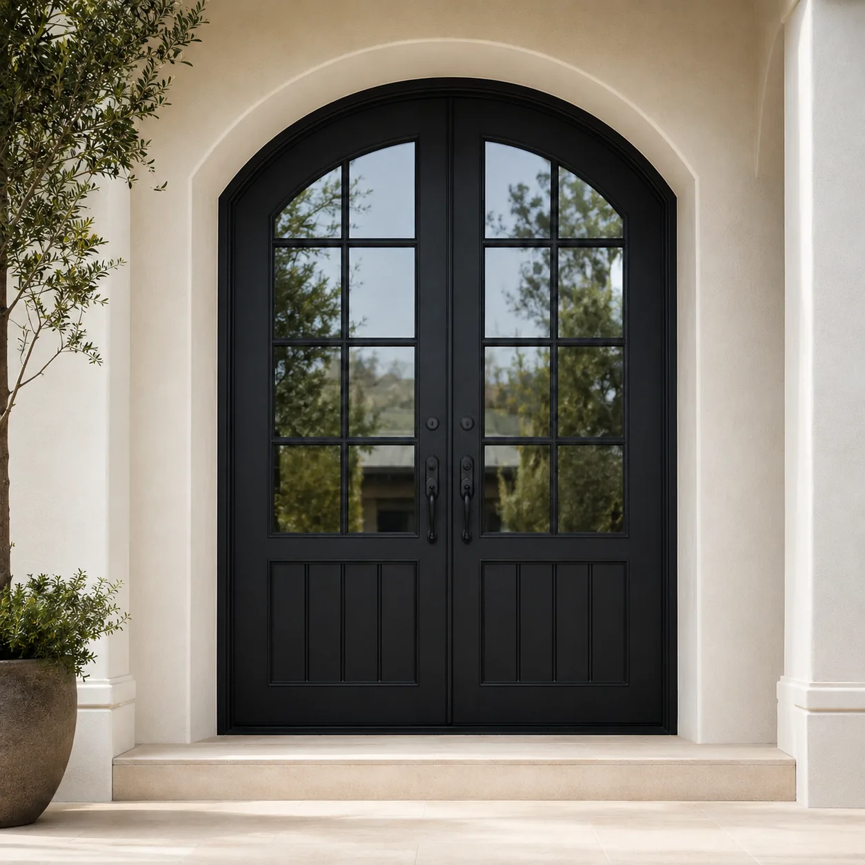Black arched double entrance door with divided glass panes