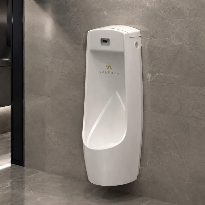 Full-height urinal reaching the floor, with an infrared flush sensor
